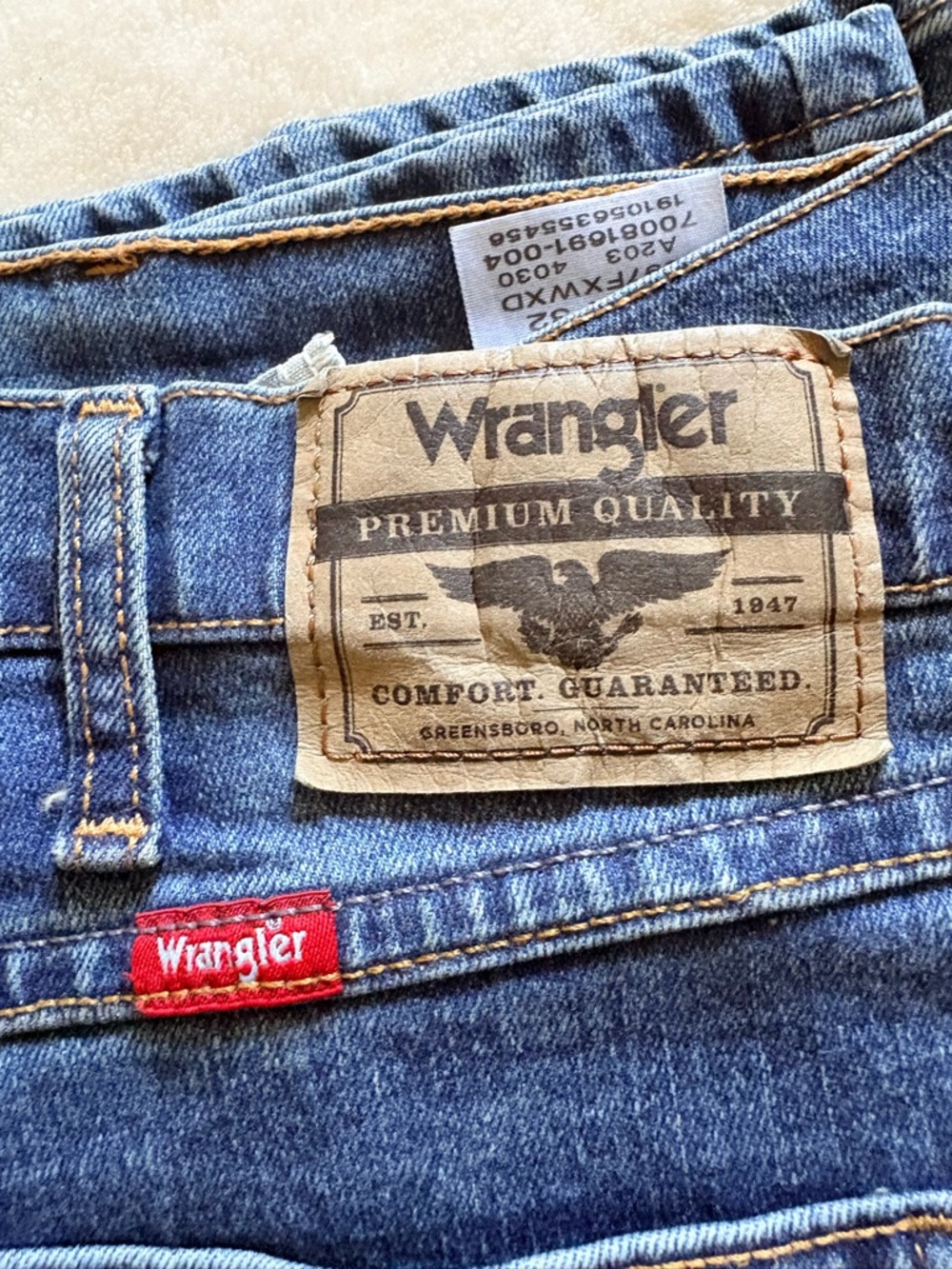 Wrangler Denim Jeans with Red Logo Tab and Leather Patch